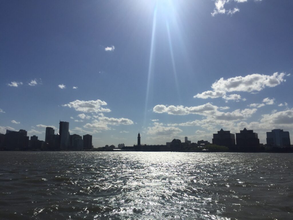 Picture of the New York City skyline taken from a boat. 